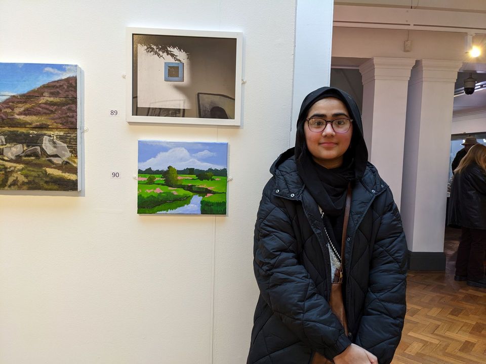 Student at art exhibiition