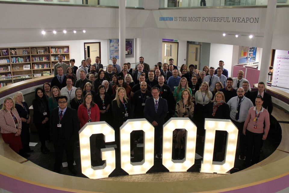All staff group image with 'good' light up letters
