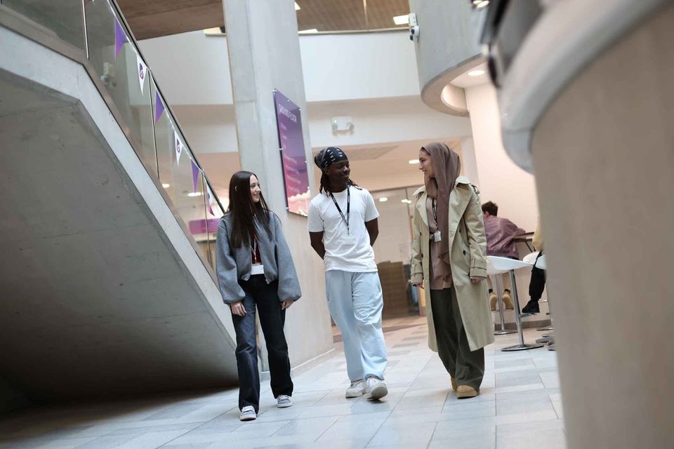 Image of students walking in building