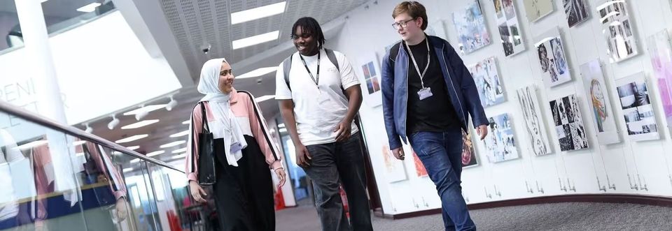 image of three students walking