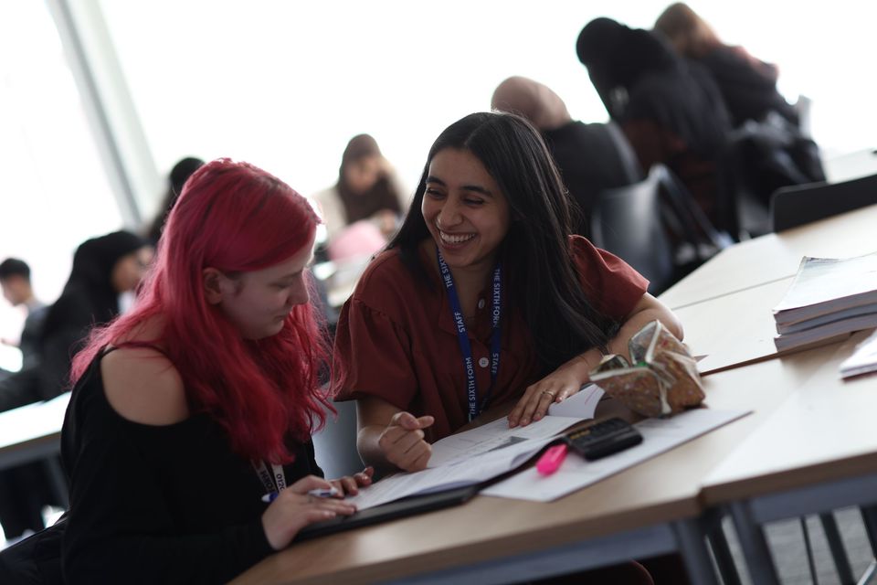 Image of staff member and student