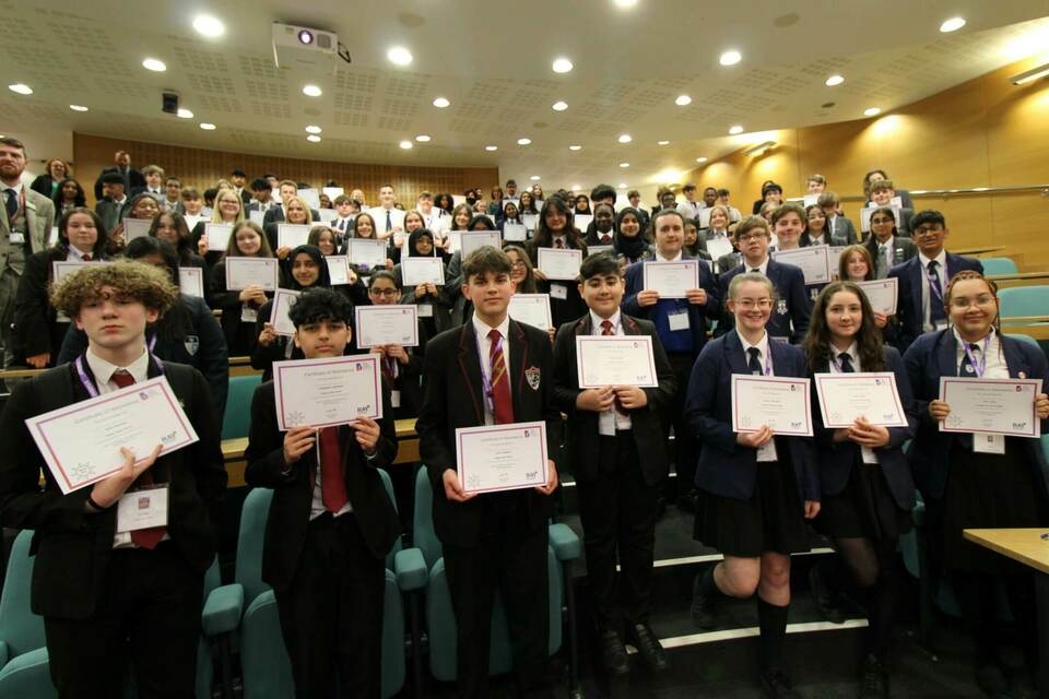 Group of school students with certificates