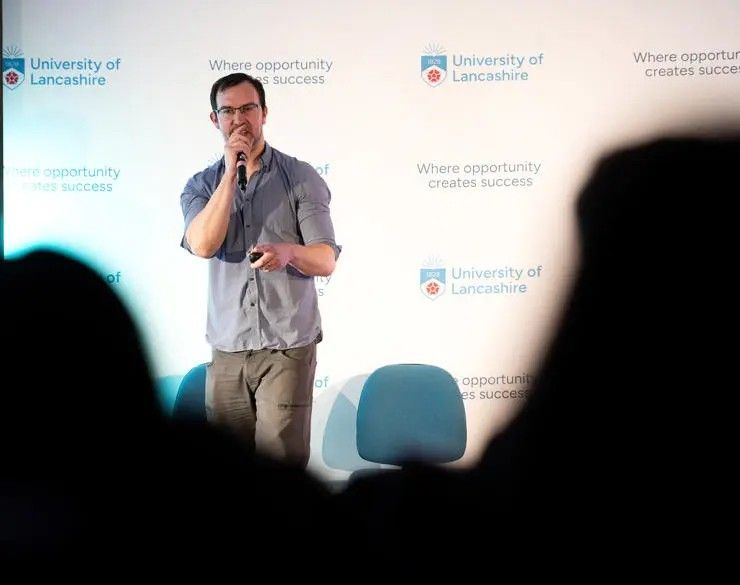 Image of man delivering talk Image of man delivering talk