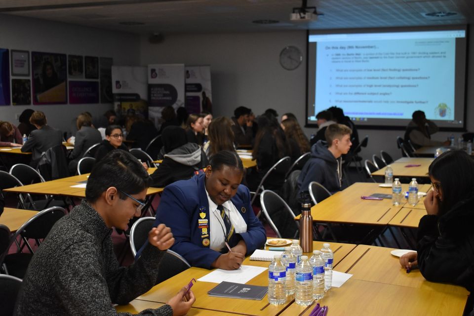 Image of students sat at tables