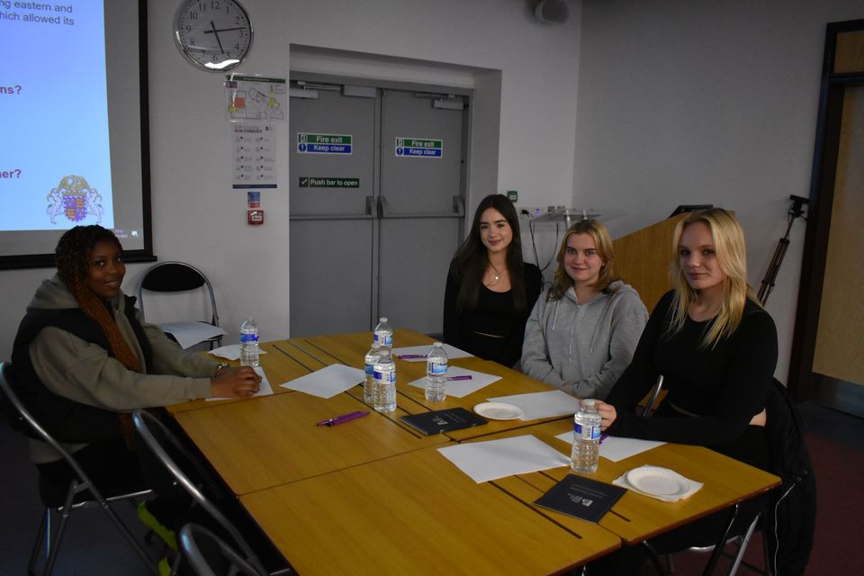 Image of students sat at tables