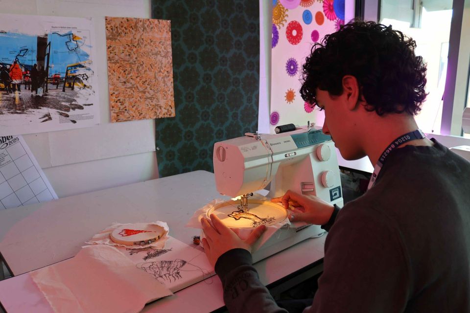 Image of student on sewing machine Image of student on sewing machine