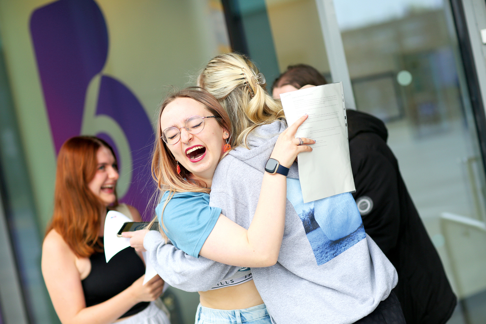 Image of a student celebrating receiving their results