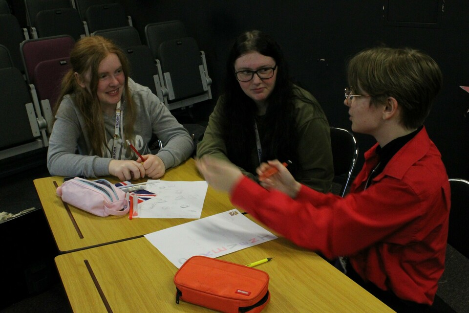 Three students doing group work