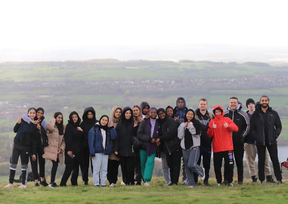 Large group of students and staff on hiking trip