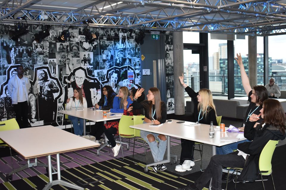 Students sat at tables